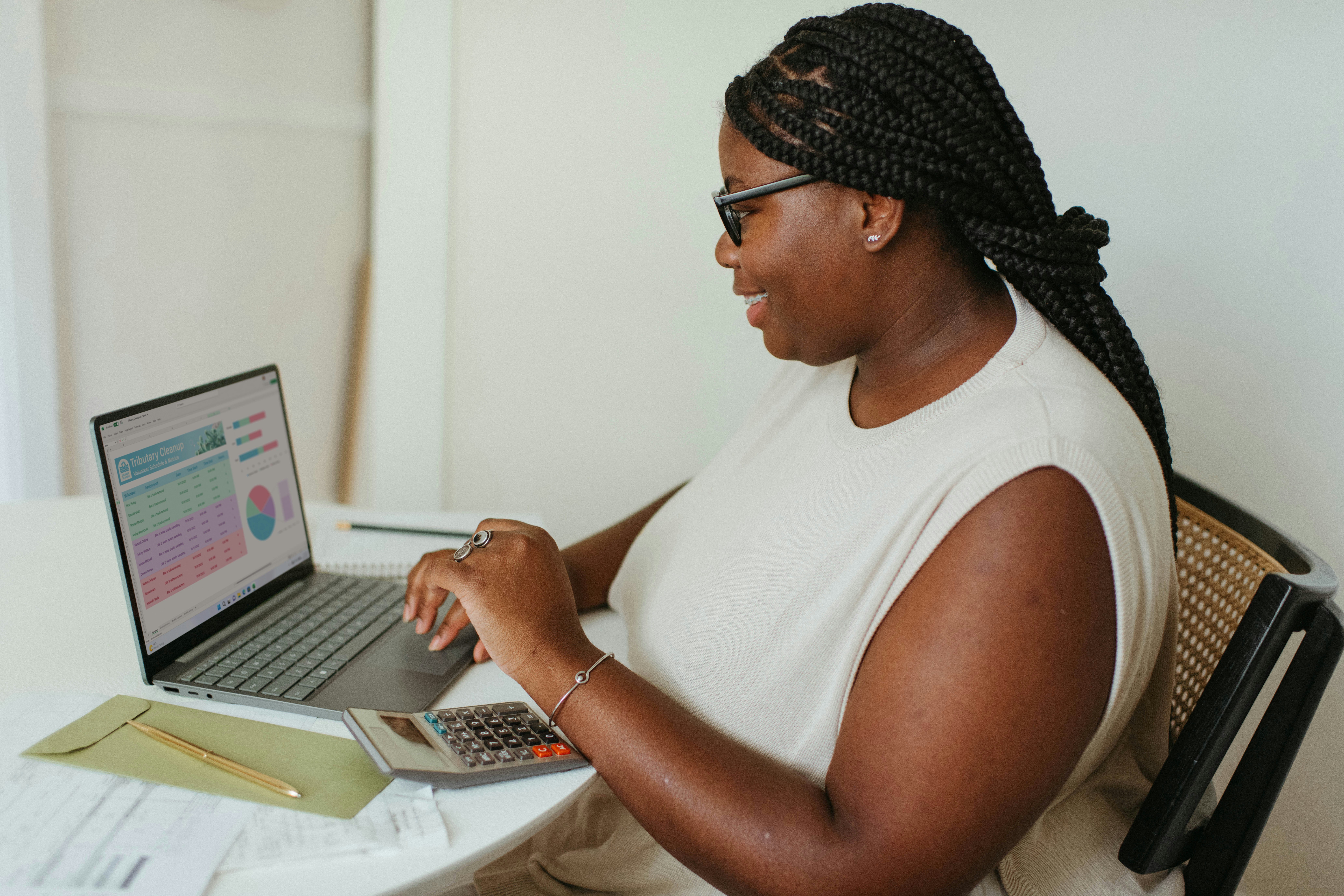 Woman using a computer and smiling