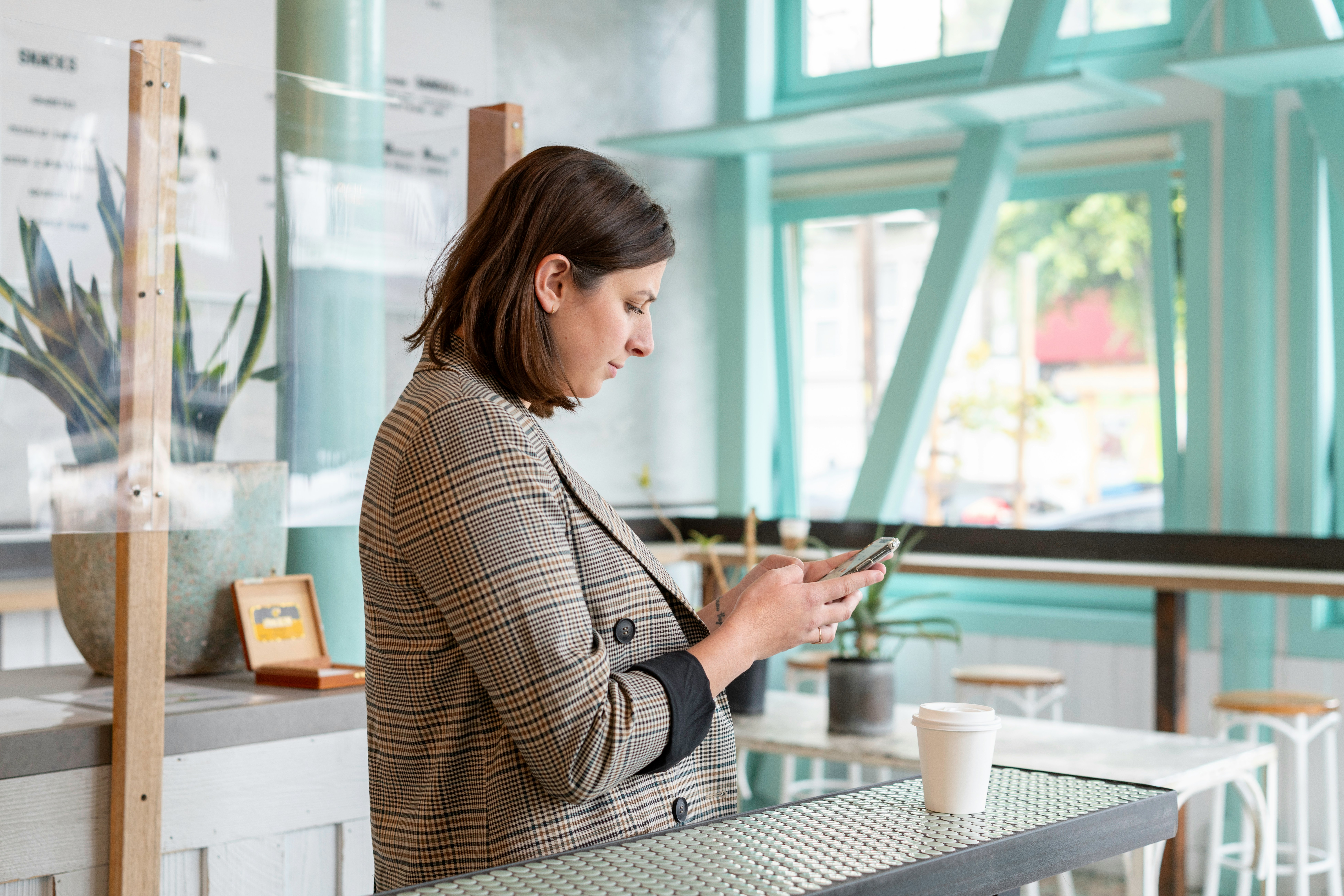 Woman looking down into mobile phone