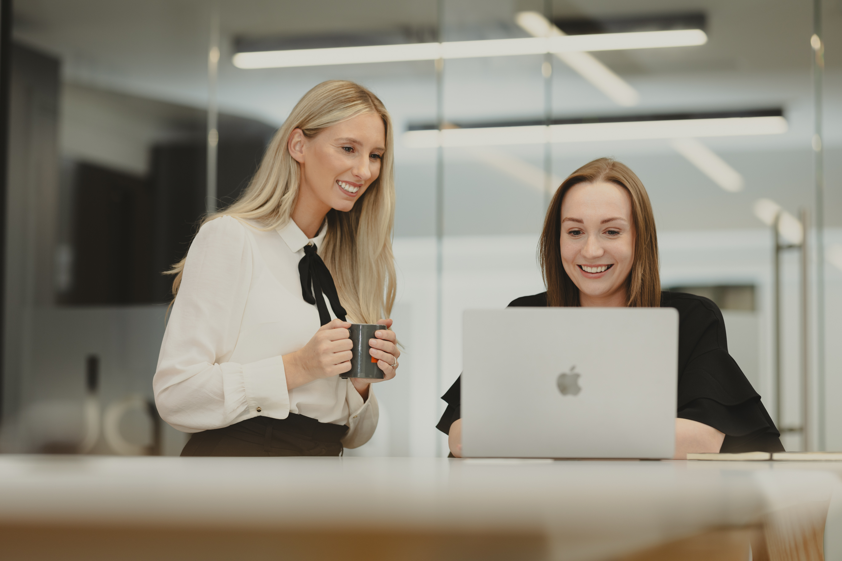 Two women in office looking at computer