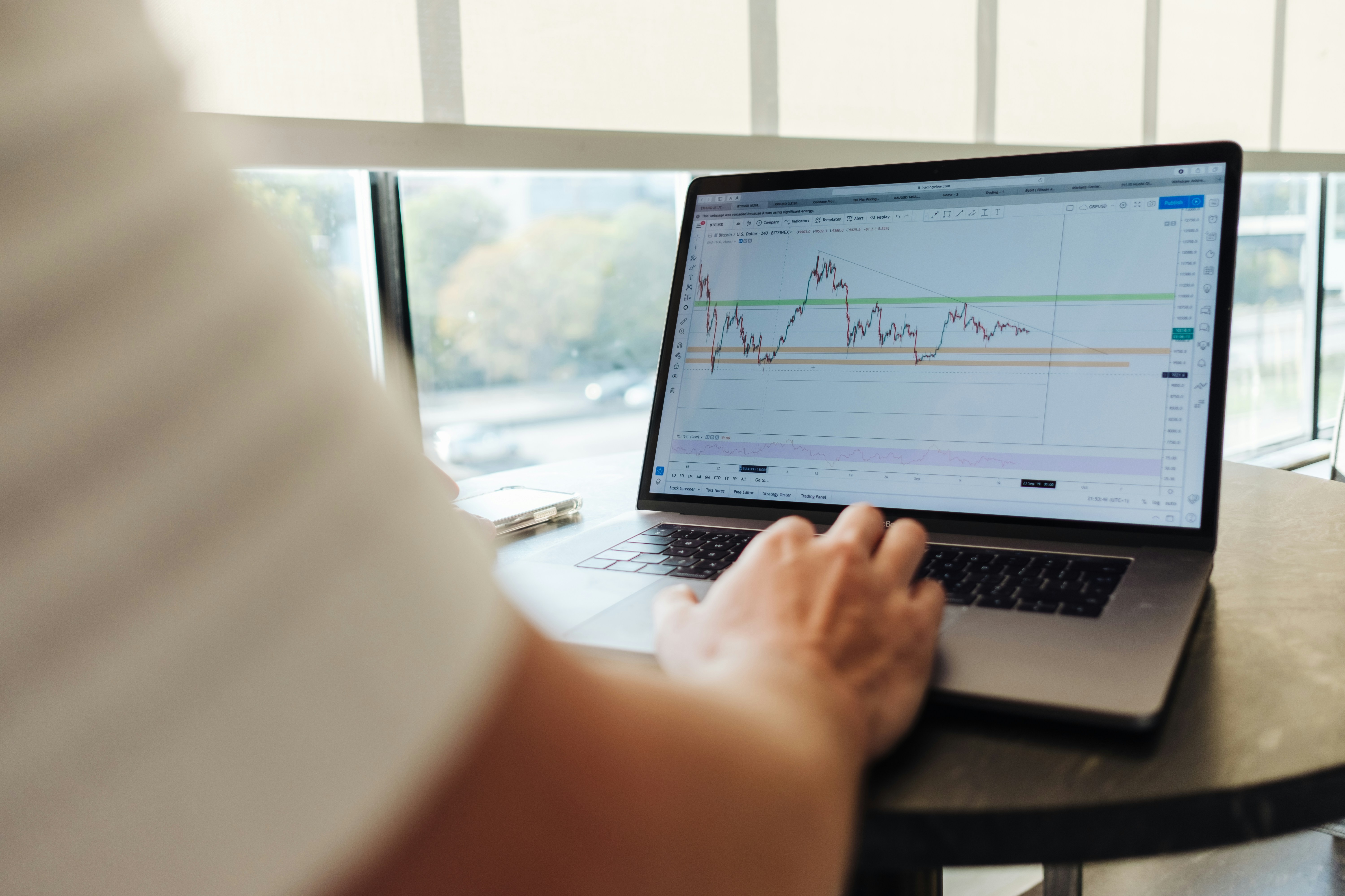 A man looking at a graph on a computer