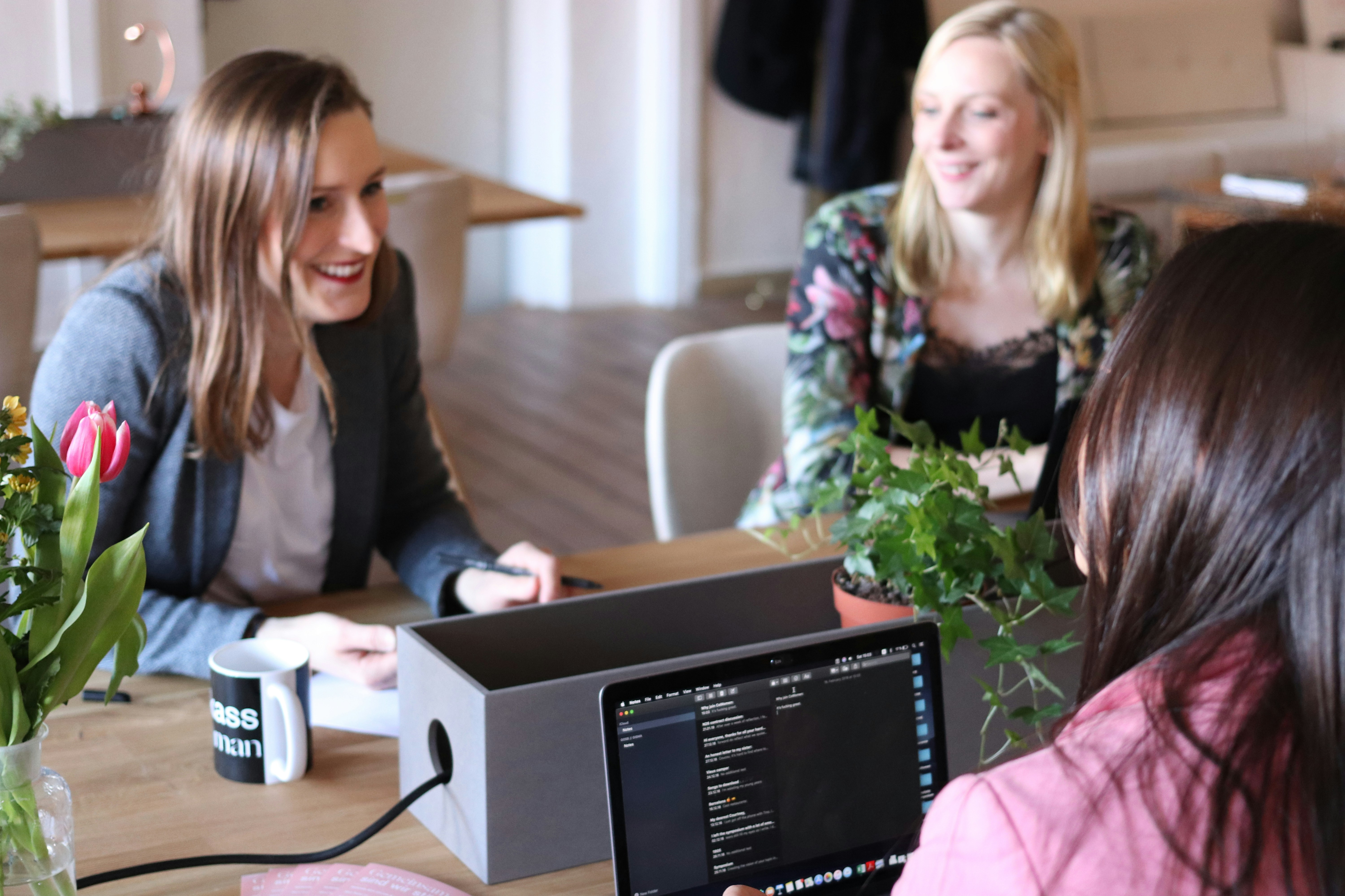 Three women in working in office