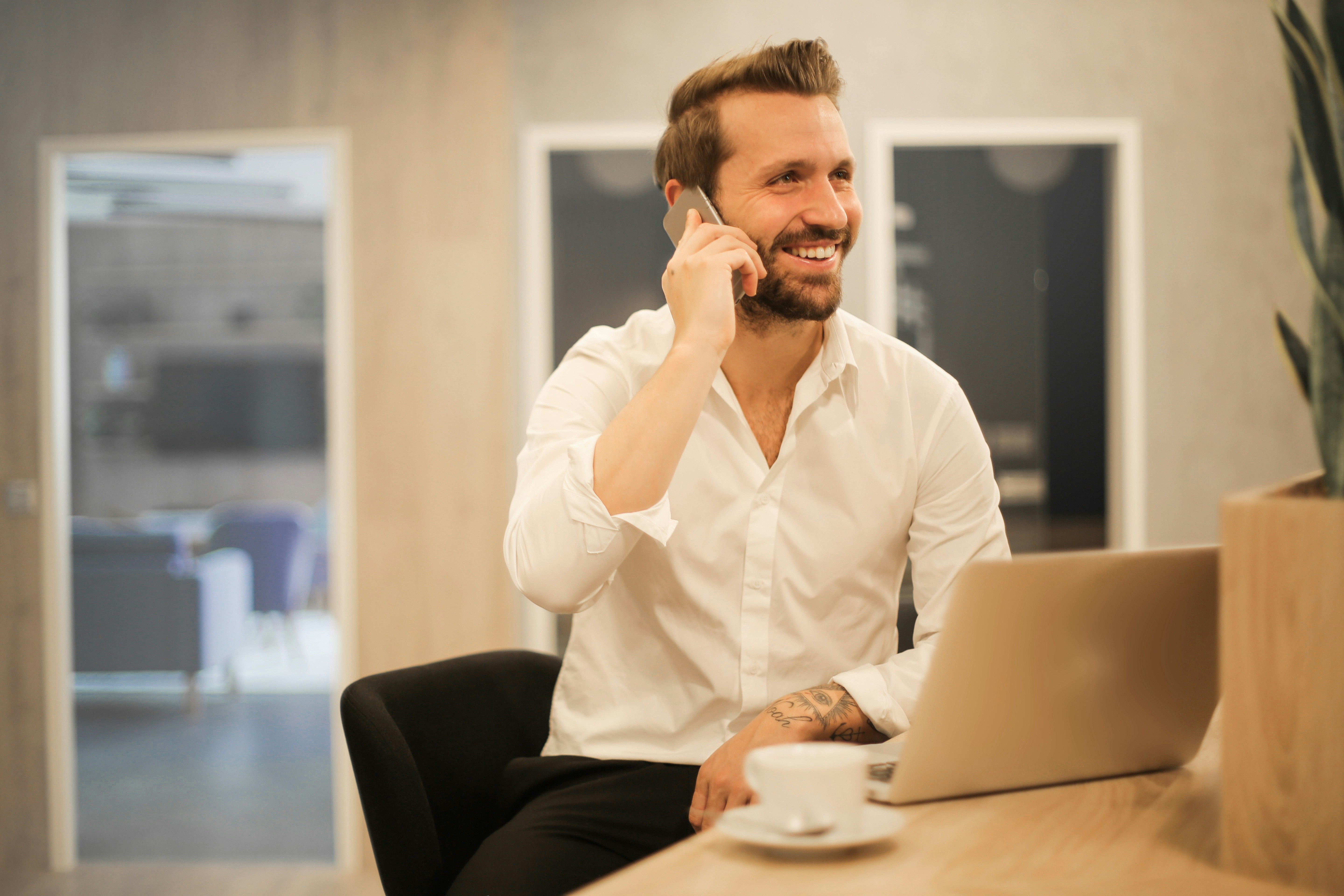 Man smiling on mobile phone